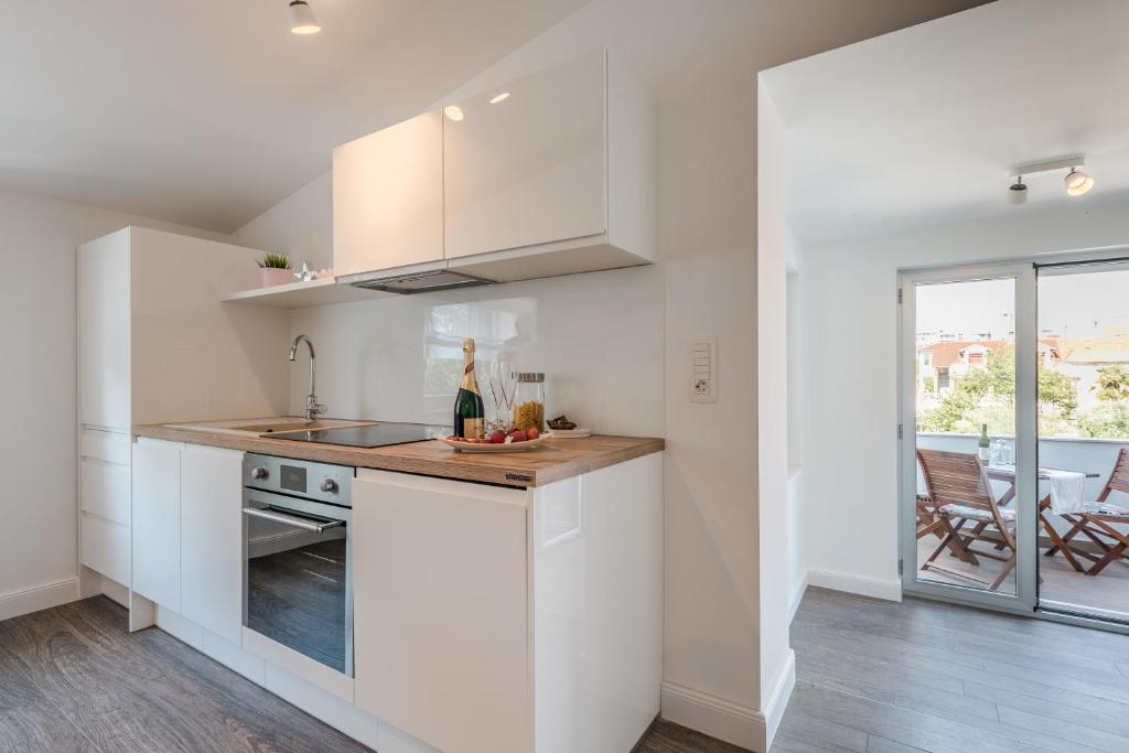 Kuchyň nebo kuchyňský kout v ubytování Apartments Ena