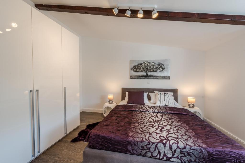 Postel nebo postele na pokoji v ubytování Apartments Ena