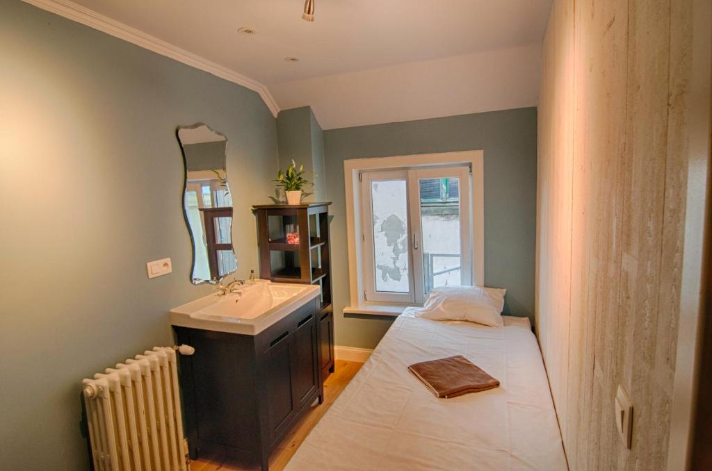 Postel nebo postele na pokoji v ubytování Hostel Lybeer Bruges