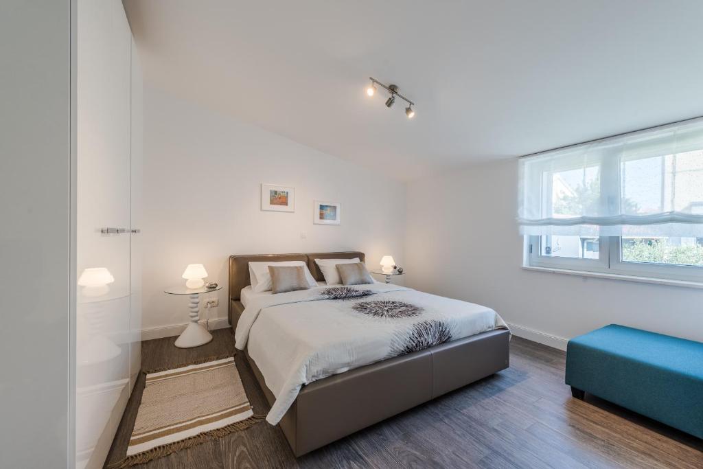 Postel nebo postele na pokoji v ubytování Apartments Ena