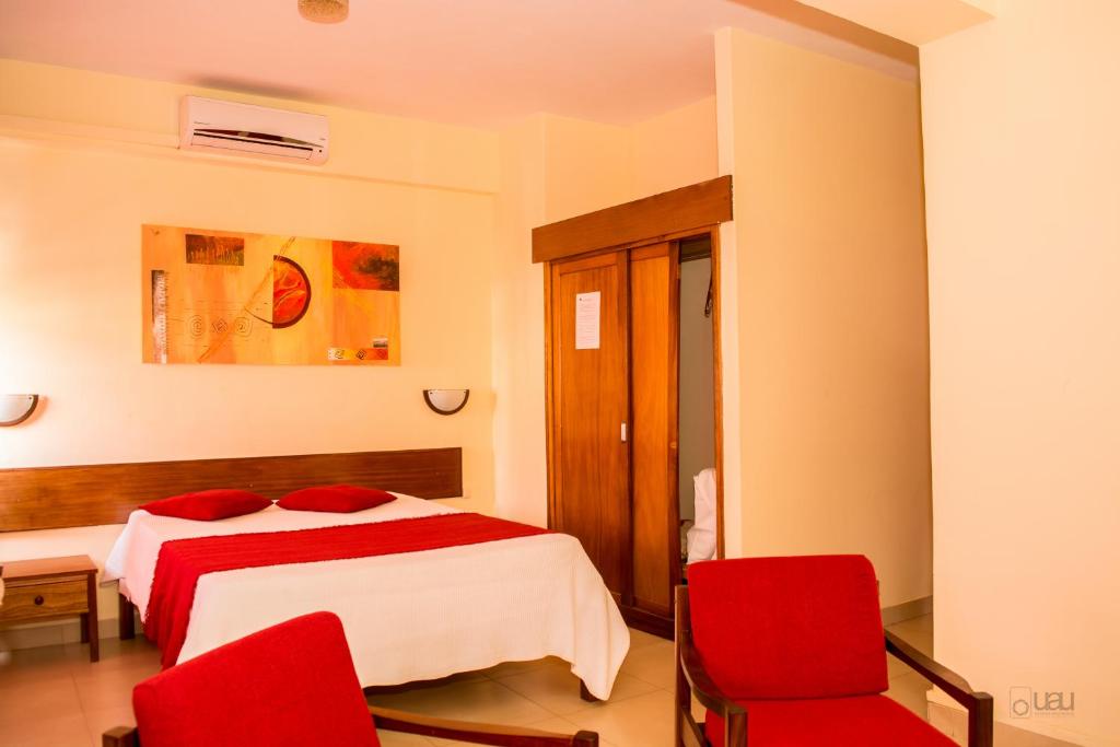 Postel nebo postele na pokoji v ubytování Aparthotel Avenida