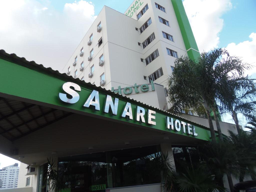 a sign for a sanchez hotel in front of a building at Sanare Hotel in Uberlândia