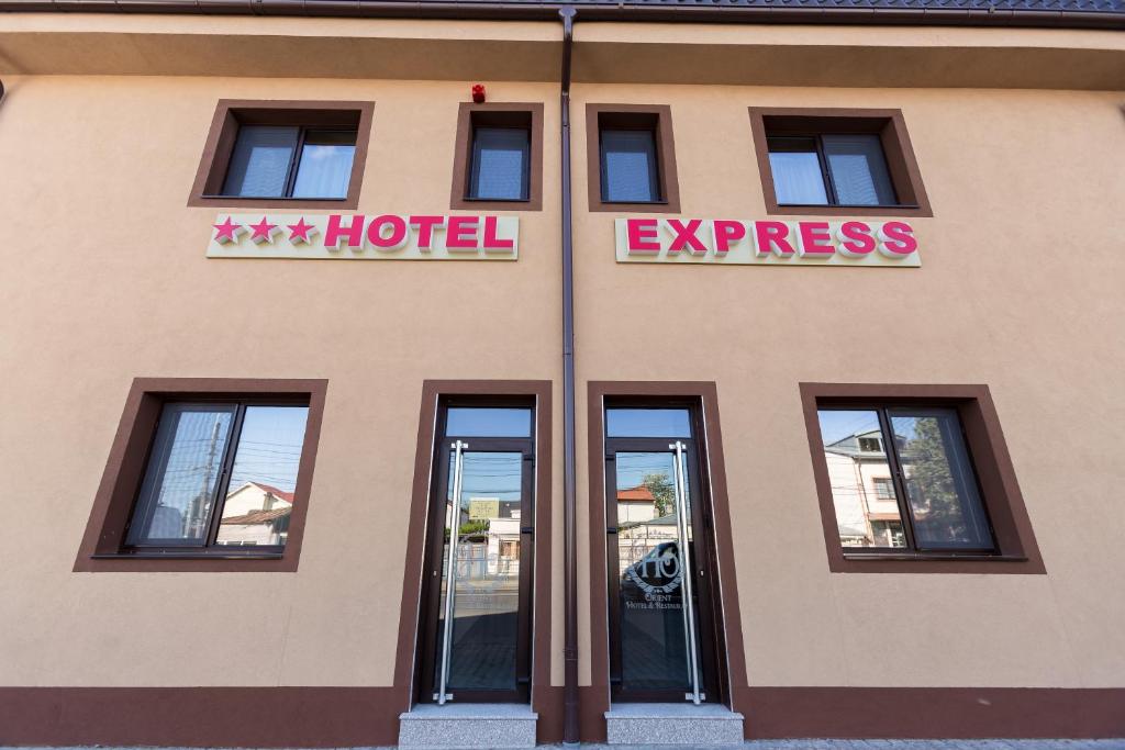 a hotel with a sign on the side of a building at Express Residence in Brăila