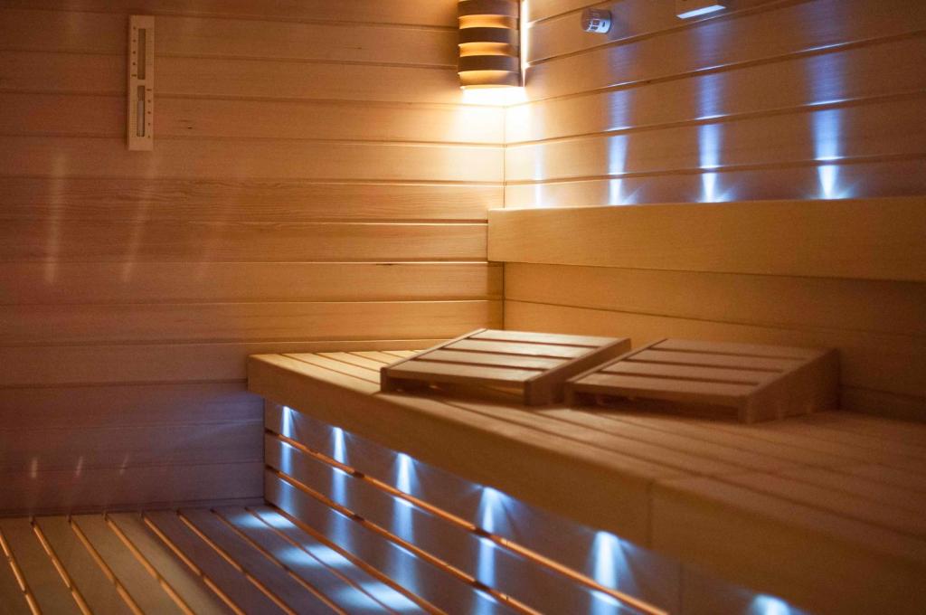 a sauna with two beds in it with lights at Hotel Cliff Belvedere in Izola