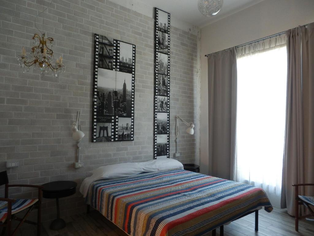 Postel nebo postele na pokoji v ubytování BB SharingLoft Sirmione