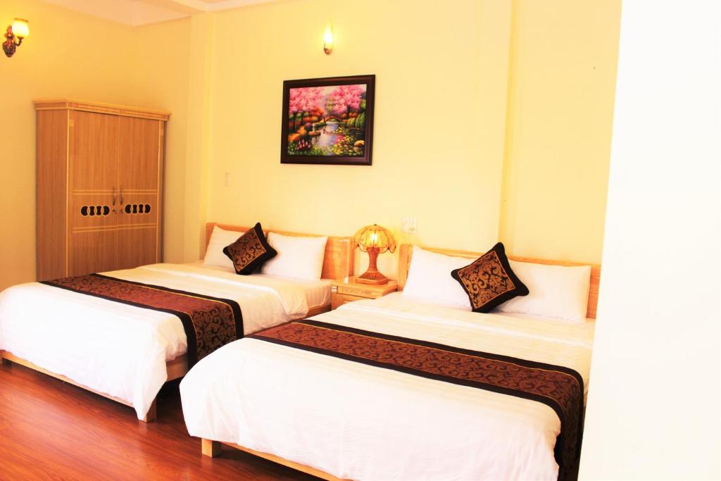 Postel nebo postele na pokoji v ubytování Thien Phu Guesthouse Dalat