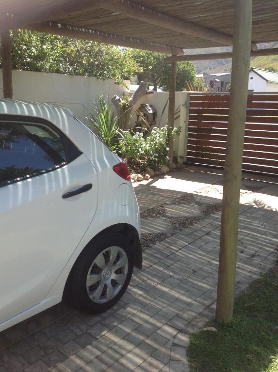 a white car parked under a pergola at 77 ON 7th Street in Hermanus