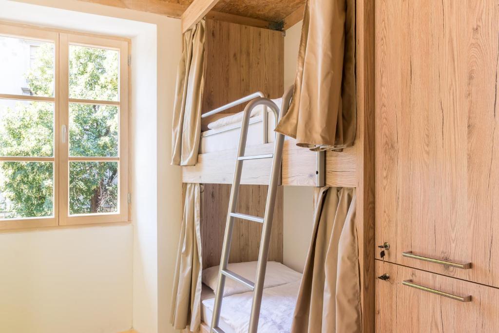 Postel nebo postele na pokoji v ubytování Hostel Antique