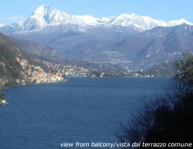 a view of a lake with snow covered mountains at Crotto Letizia in Argegno