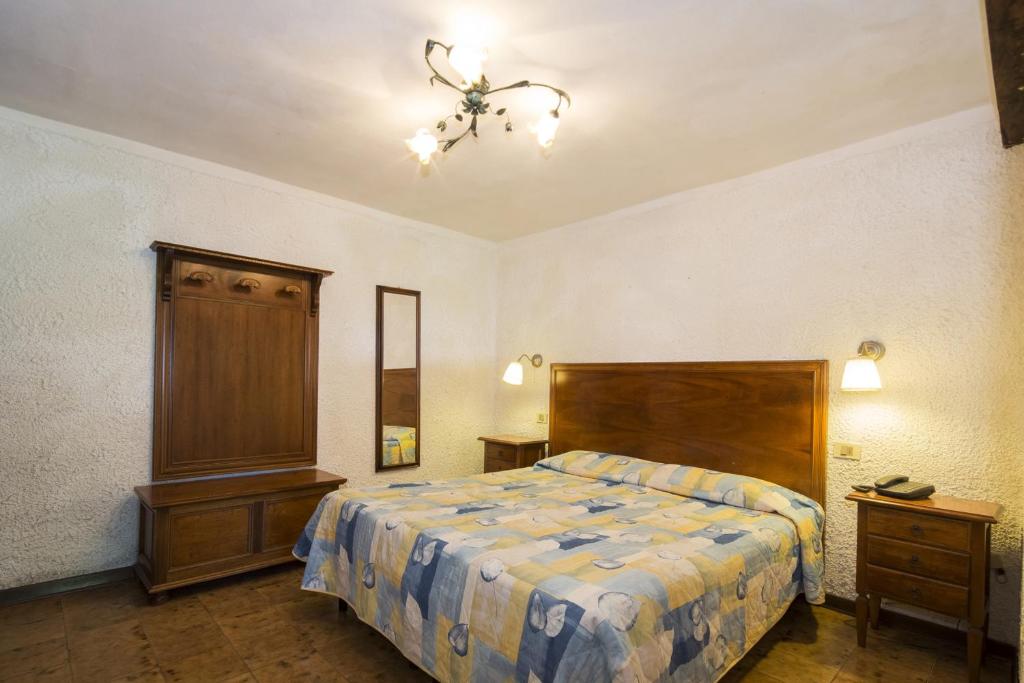 Postel nebo postele na pokoji v ubytování Hotel Rifugio Prategiano