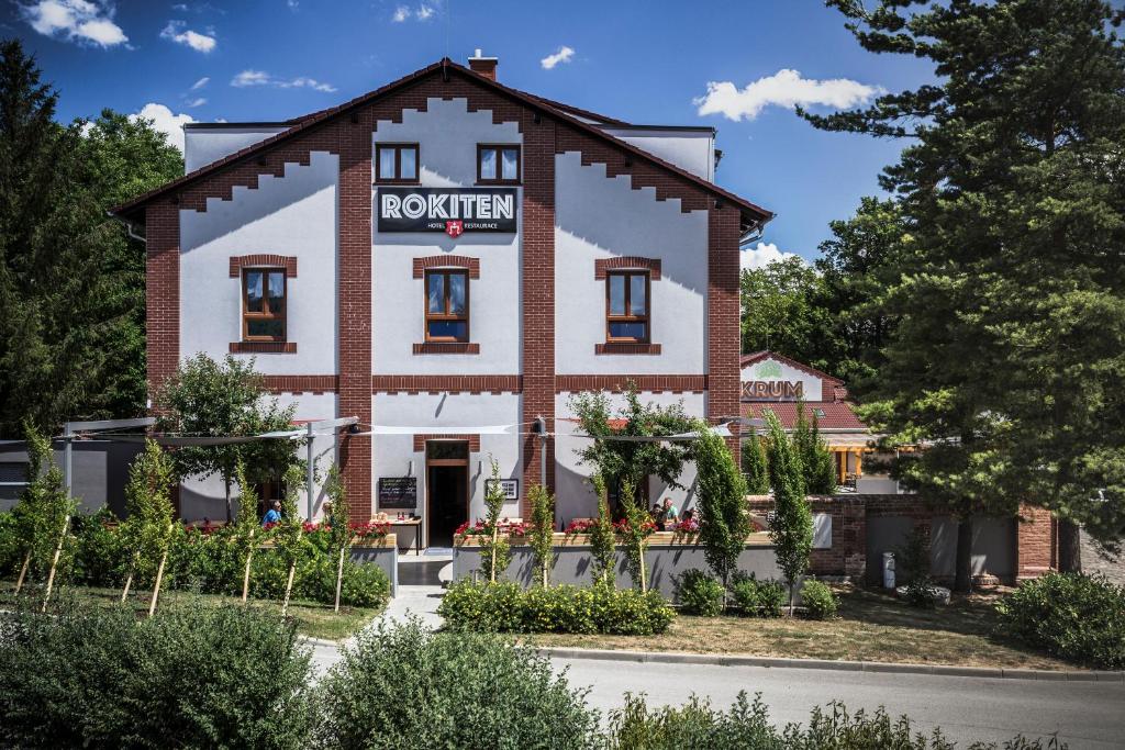 a building with a sign that reads roeland at Hotel Rokiten in Moravský Krumlov