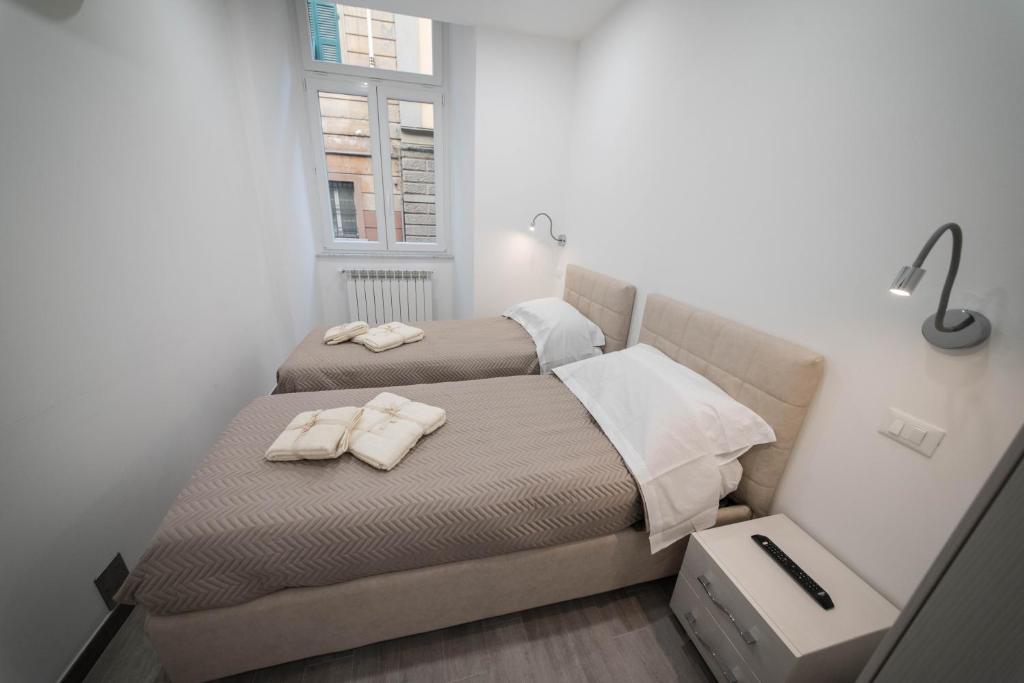 Łóżko lub łóżka w pokoju w obiekcie 5 Terre Lodge