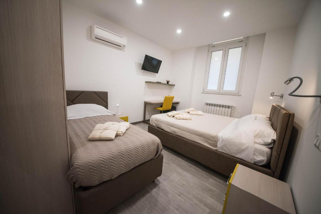 Łóżko lub łóżka w pokoju w obiekcie 5 Terre Lodge
