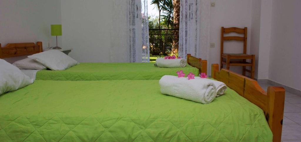 Postel nebo postele na pokoji v ubytování Olive Grove Apts