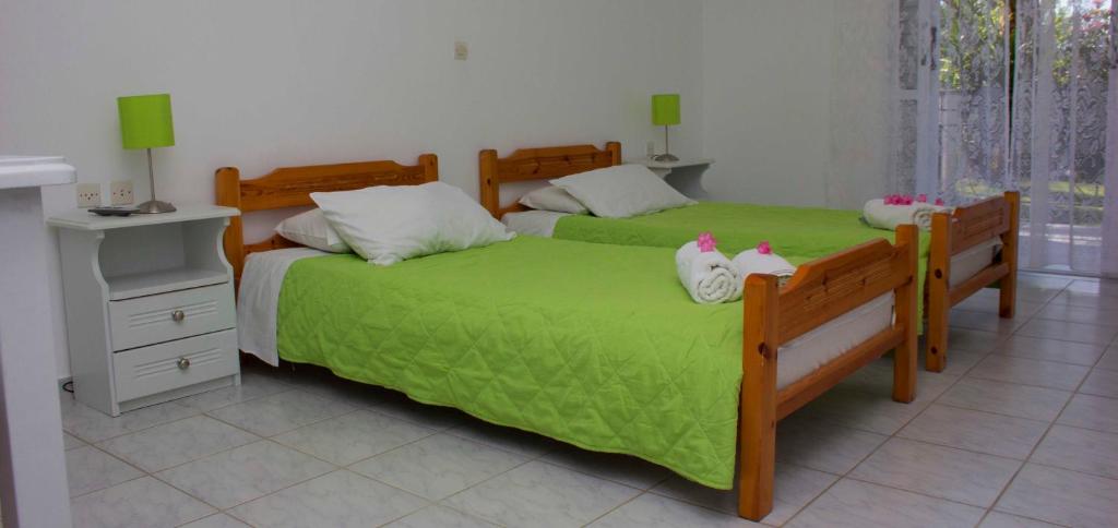 Postel nebo postele na pokoji v ubytování Olive Grove Apts