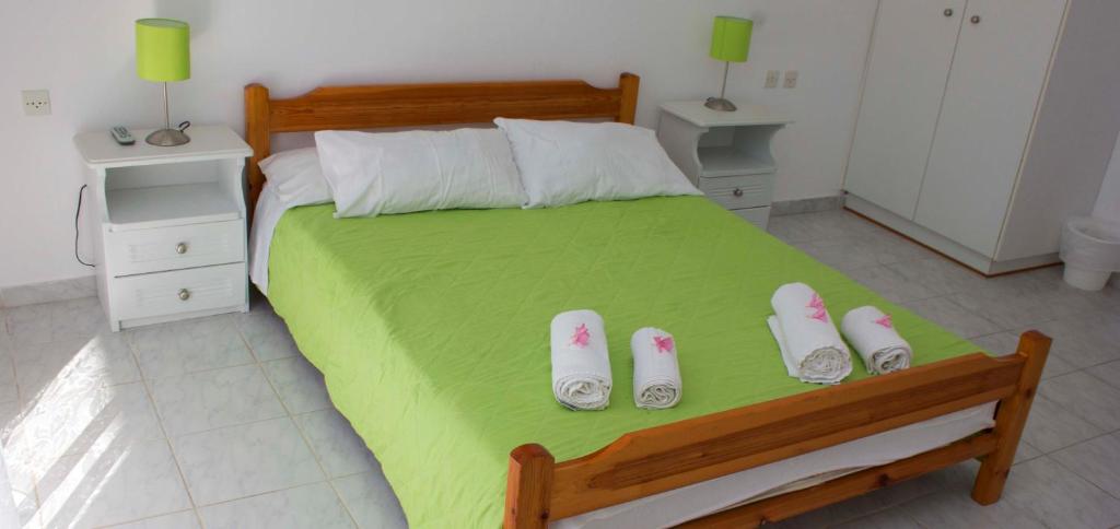 Postel nebo postele na pokoji v ubytování Olive Grove Apts