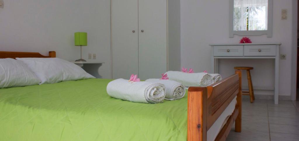 Postel nebo postele na pokoji v ubytování Olive Grove Apts