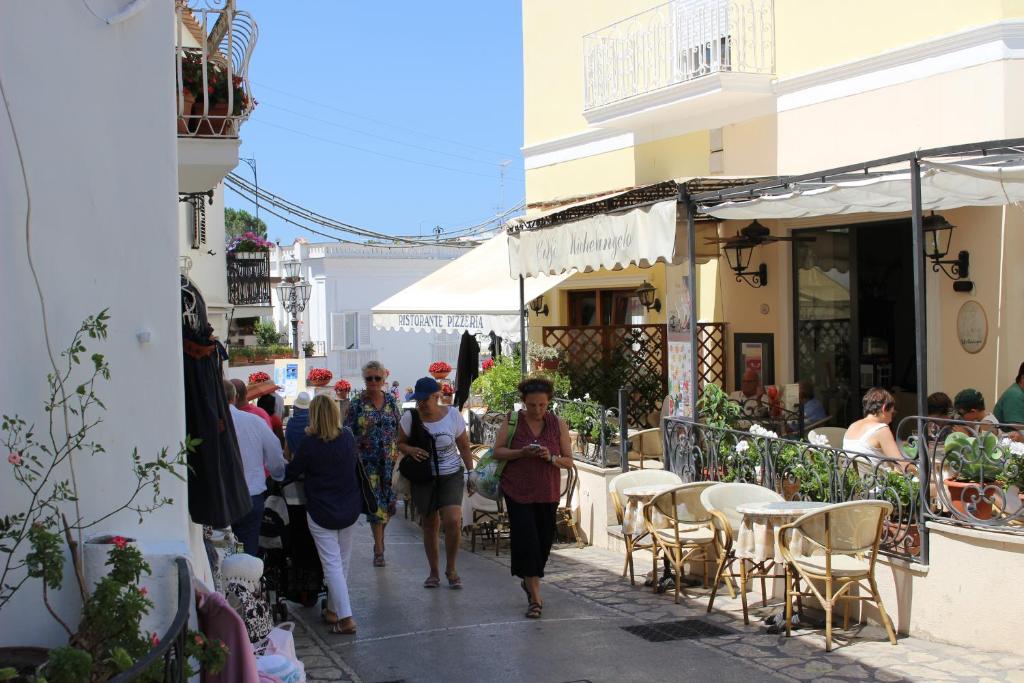 a group of people walking down a street at Villa Pollio Guest House in Anacapri