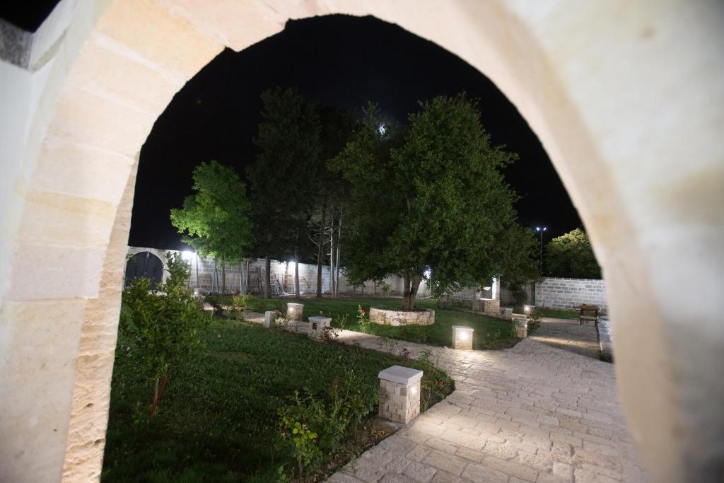 an archway in a cemetery at night at Room Donna Sandra in Veglie