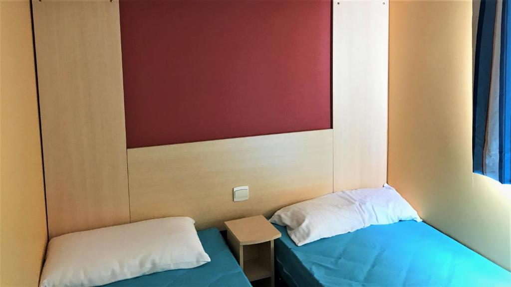 Postel nebo postele na pokoji v ubytování Camping Pirinenc