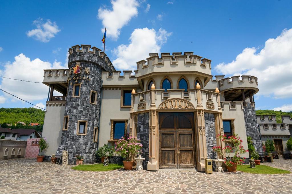 a castle style building with a large door at LaCetate Boutique Hotel in Piteşti