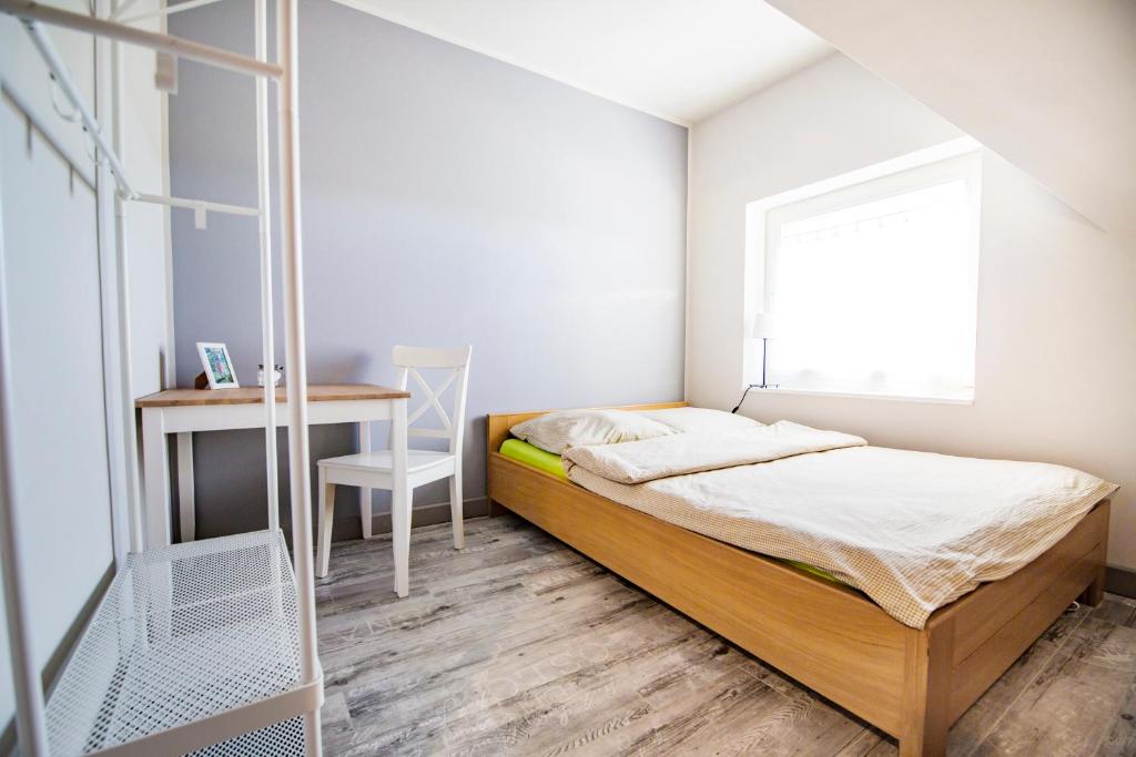 Postel nebo postele na pokoji v ubytování Zielona Przystań