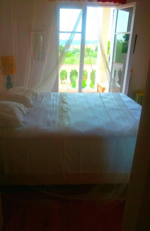 Postel nebo postele na pokoji v ubytování Villa Ancora Spetses