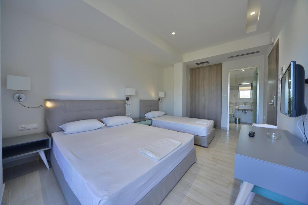 Postel nebo postele na pokoji v ubytování Hotel Kakanakos