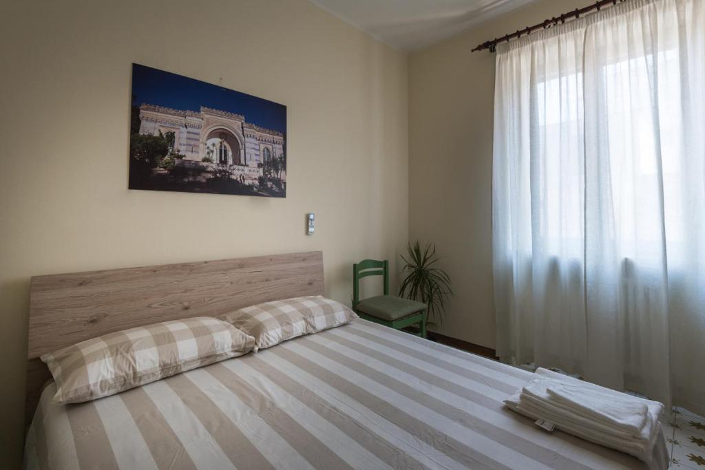Postel nebo postele na pokoji v ubytování Suite della villa