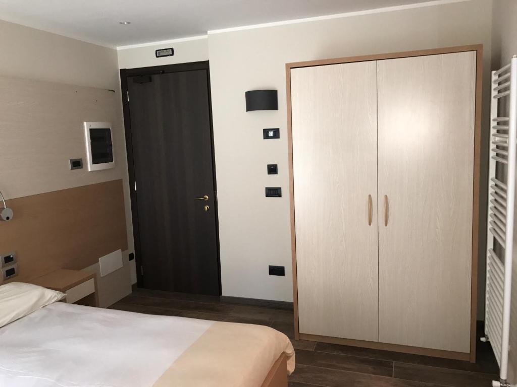 Postel nebo postele na pokoji v ubytování Hotel Le Cime