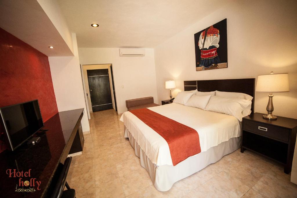 Postel nebo postele na pokoji v ubytování Hotel Holly