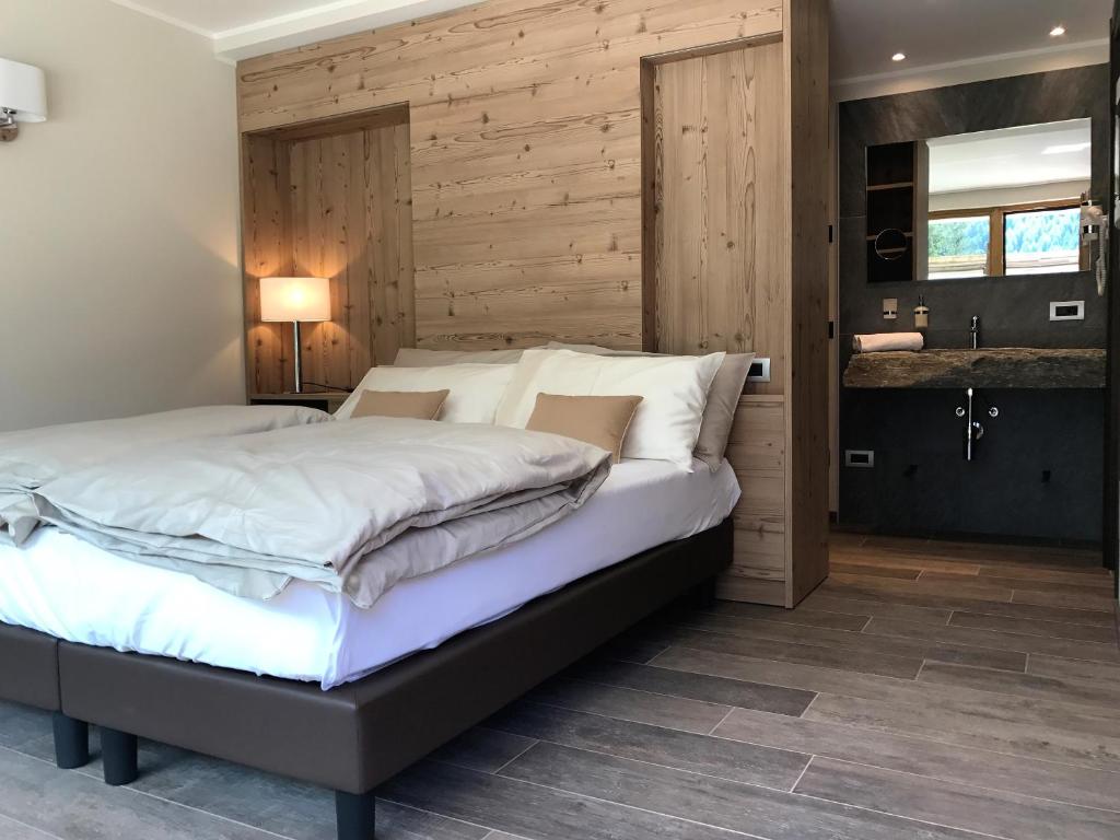 Postel nebo postele na pokoji v ubytování Hotel Le Cime
