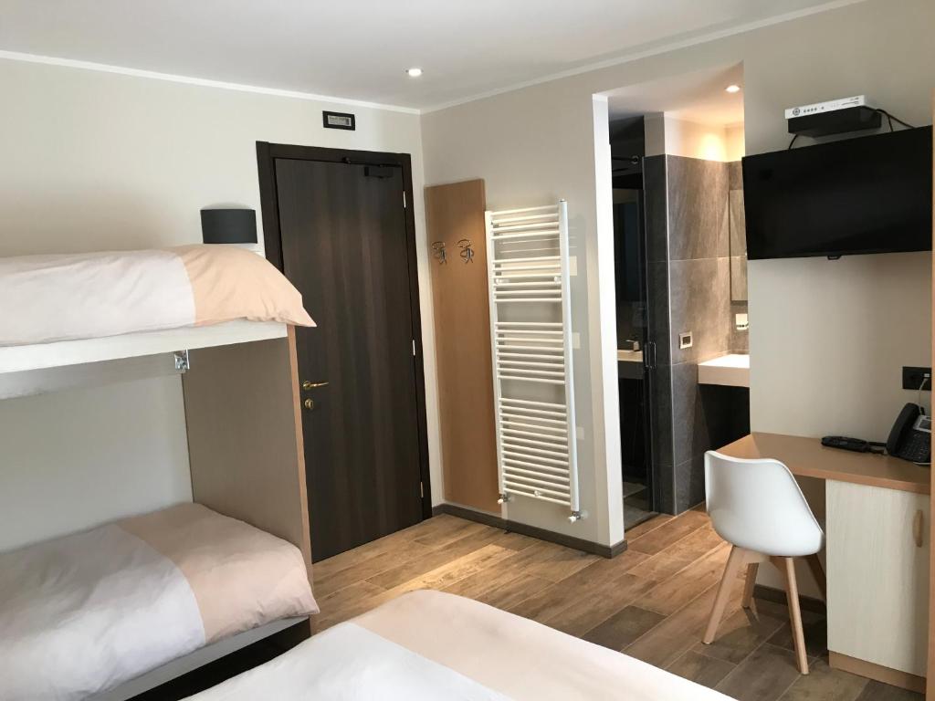 Postel nebo postele na pokoji v ubytování Hotel Le Cime