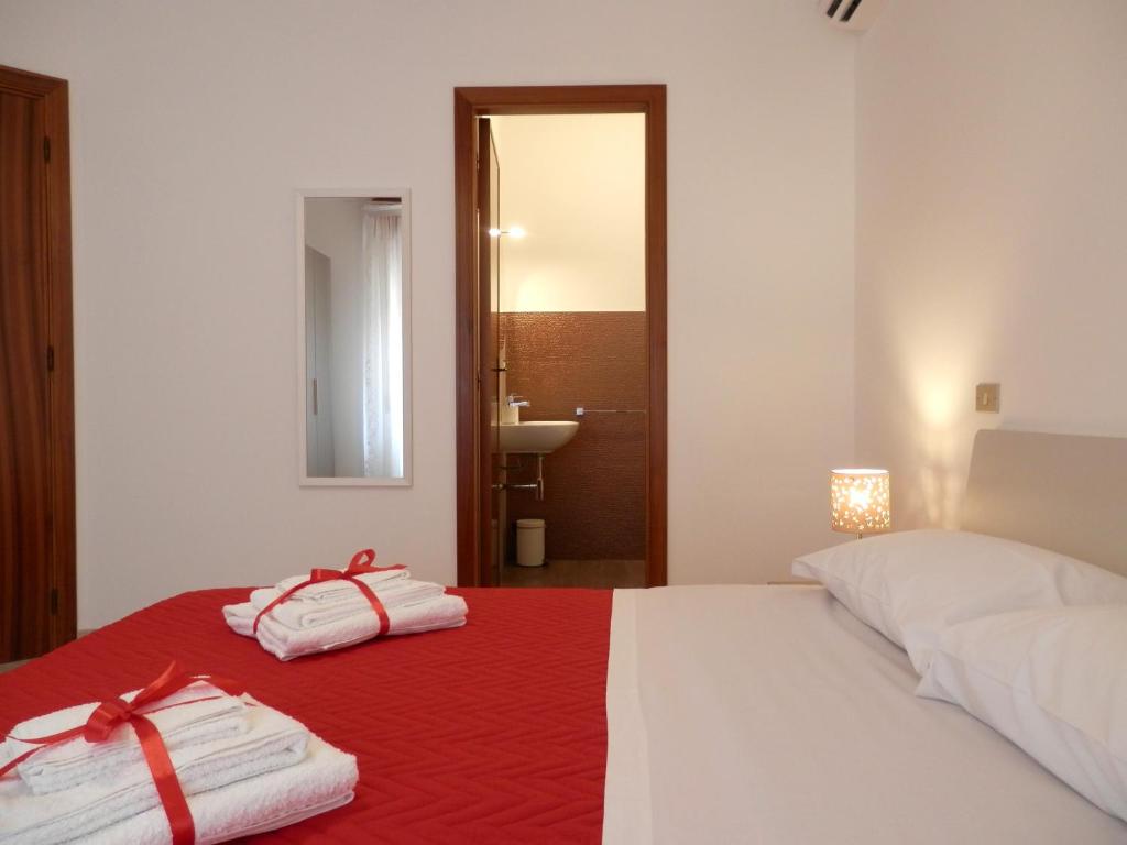 Postel nebo postele na pokoji v ubytování Corsaro B&B