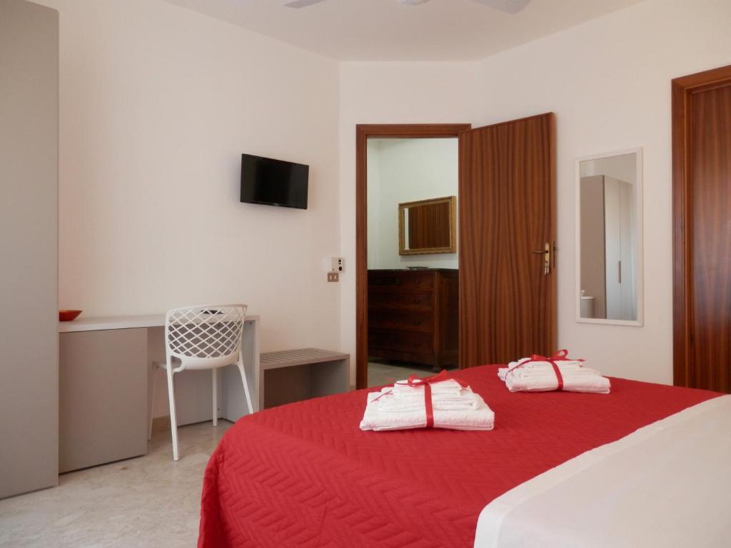 Postel nebo postele na pokoji v ubytování Corsaro B&B