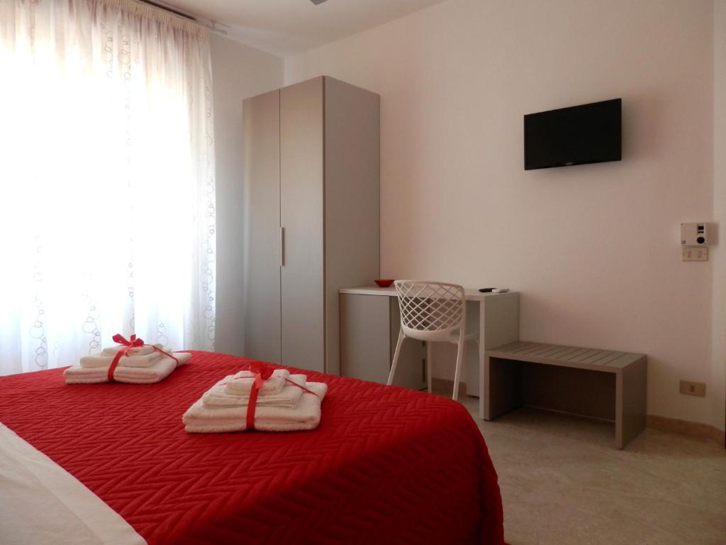 Postel nebo postele na pokoji v ubytování Corsaro B&B