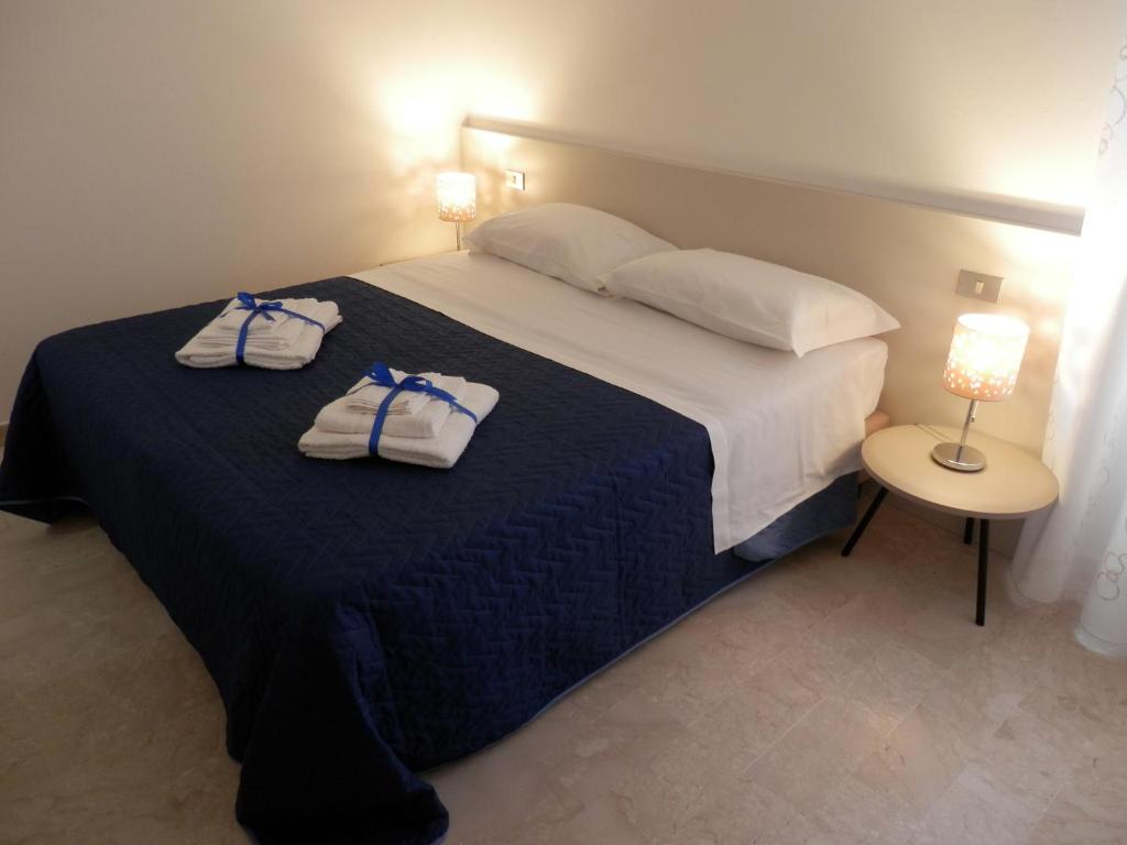 Postel nebo postele na pokoji v ubytování Corsaro B&B