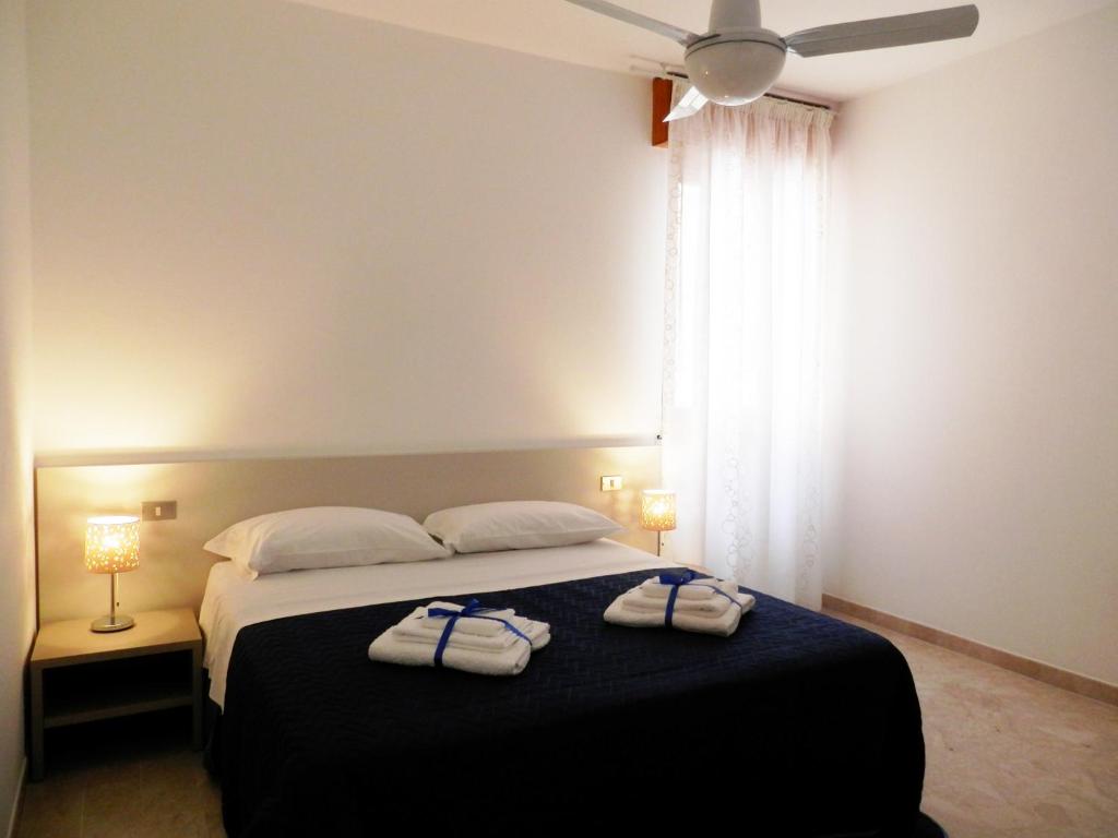 Postel nebo postele na pokoji v ubytování Corsaro B&B