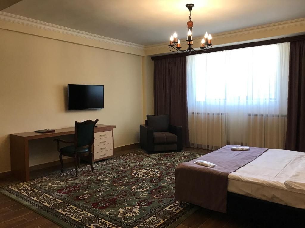 Postel nebo postele na pokoji v ubytování Hotel Plaza Viktoria