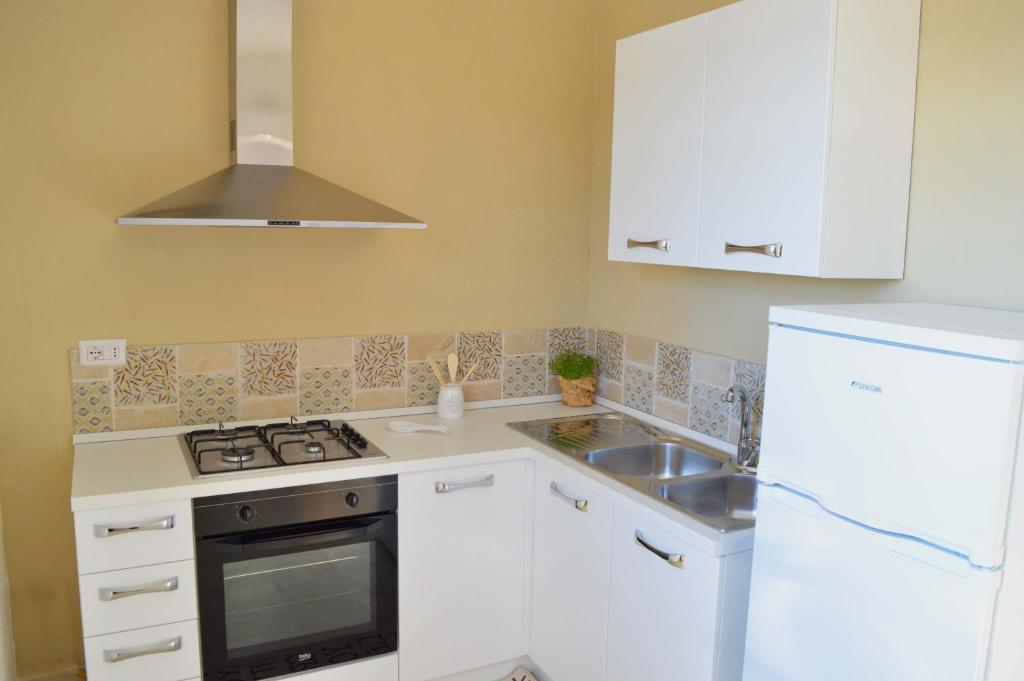 Kuchyň nebo kuchyňský kout v ubytování B&B Profumo di Alloro
