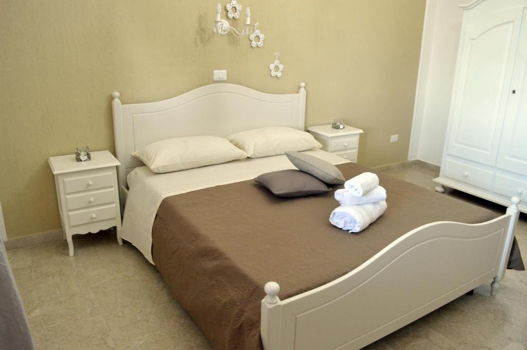 Postel nebo postele na pokoji v ubytování B&B Profumo di Alloro