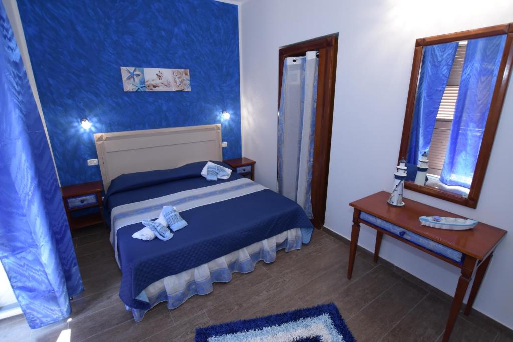 Postel nebo postele na pokoji v ubytování B&B Empedocle