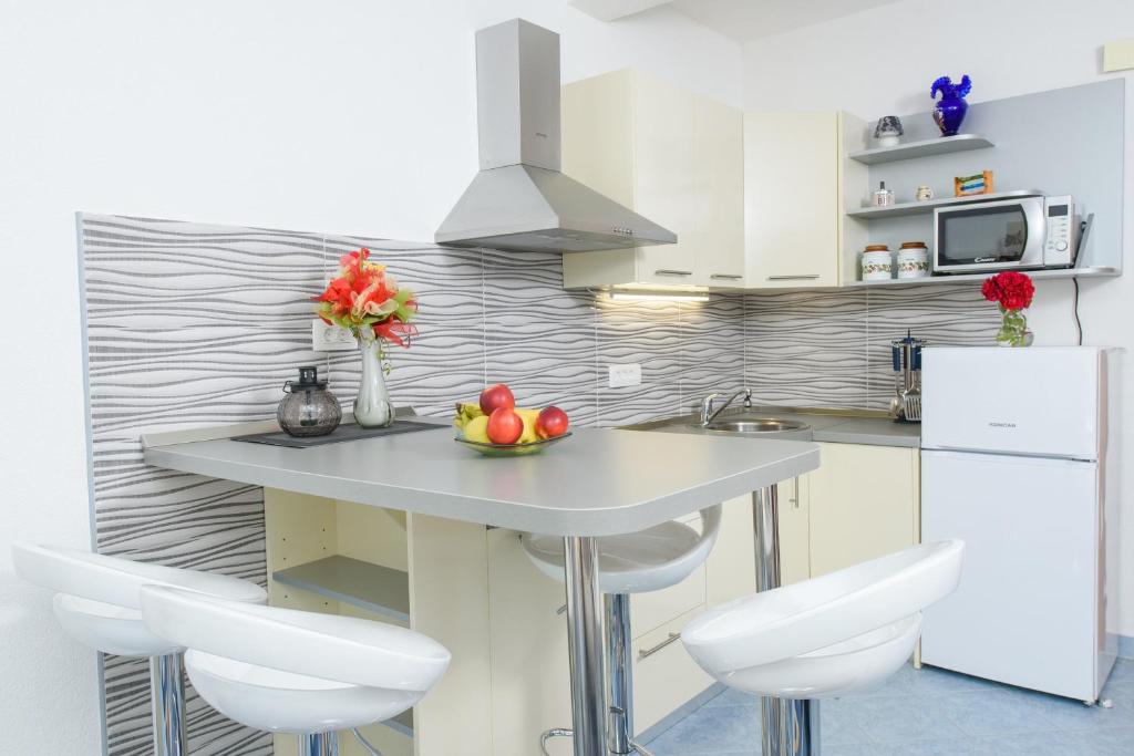 Kuchyň nebo kuchyňský kout v ubytování Apartments Patricia