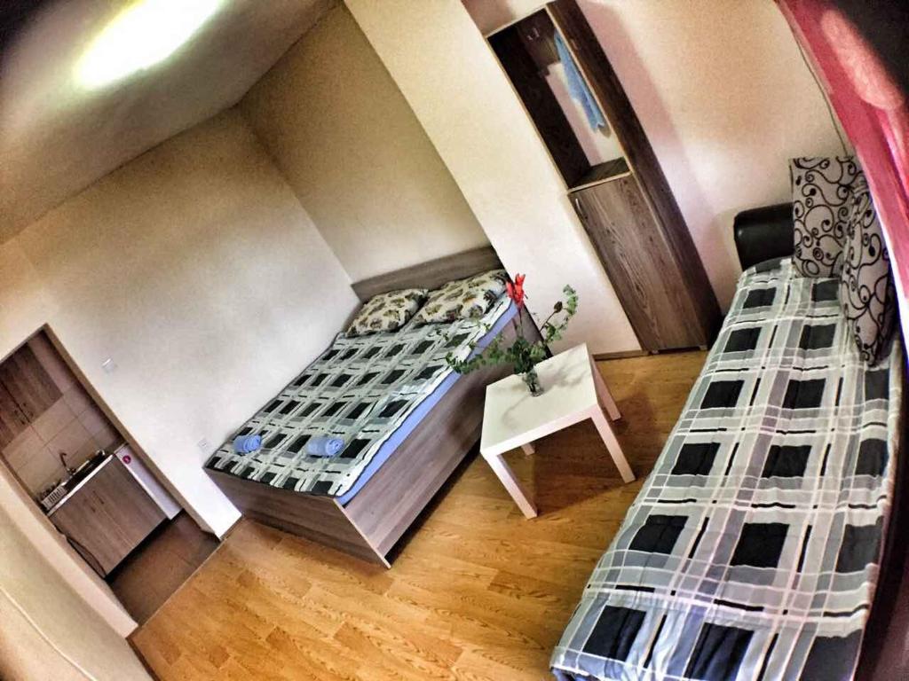 En eller flere senge i et værelse på Apartments President