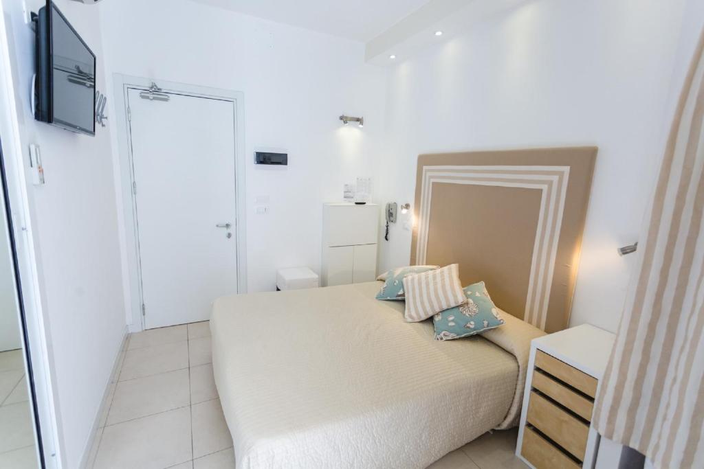 Postel nebo postele na pokoji v ubytování Hotel Speranza