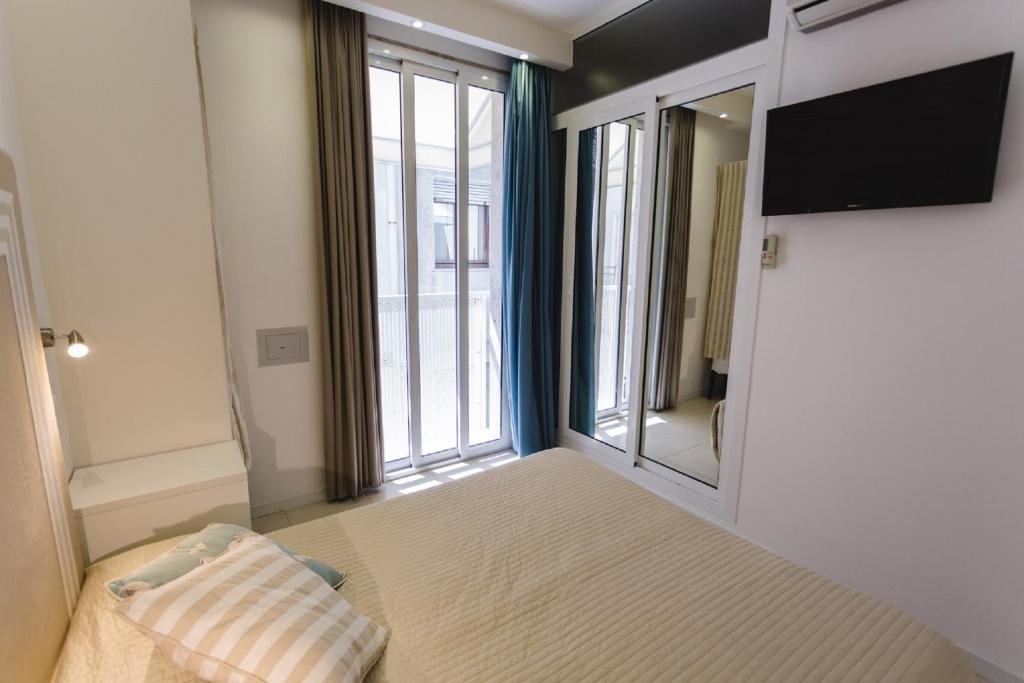 Postel nebo postele na pokoji v ubytování Hotel Speranza