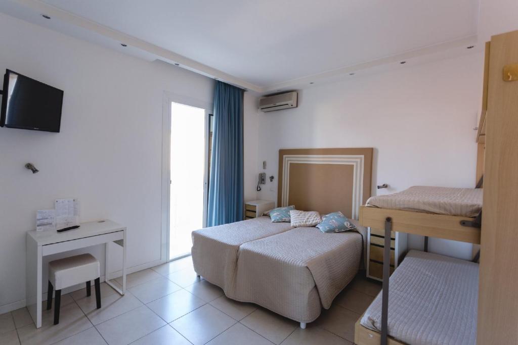 Postel nebo postele na pokoji v ubytování Hotel Speranza