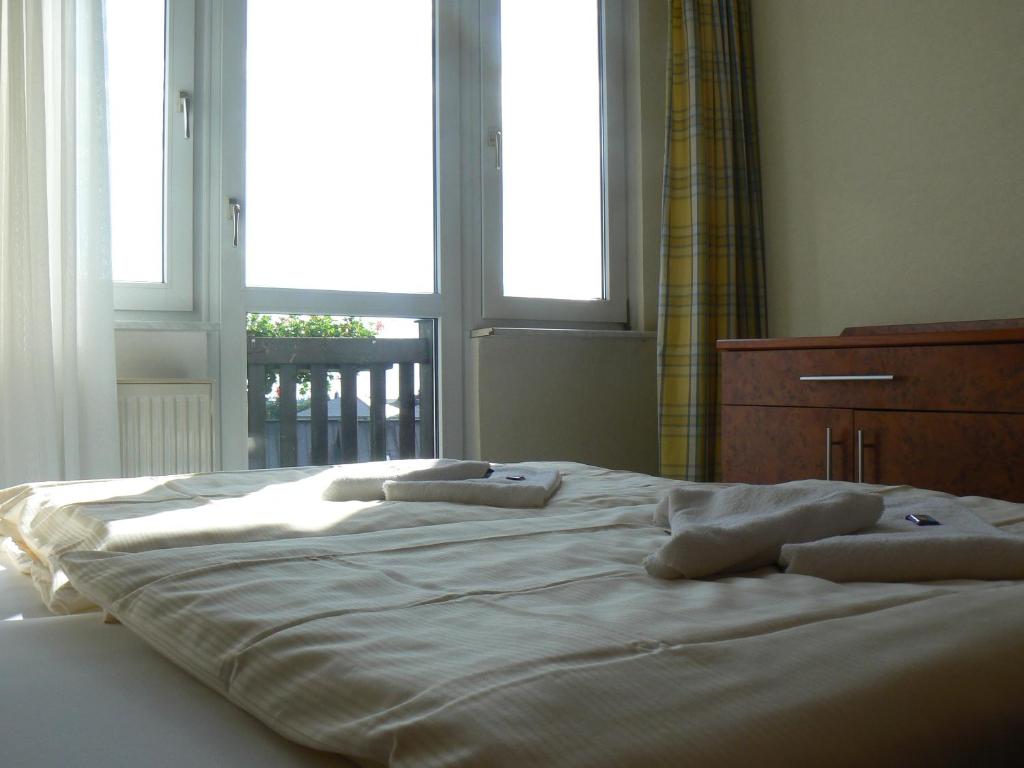 Postel nebo postele na pokoji v ubytování WAGNERS Sporthotel Oberhof
