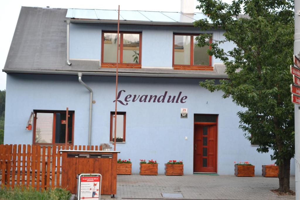 a blue house with a sign that reads lenanda at Levandule in Brno