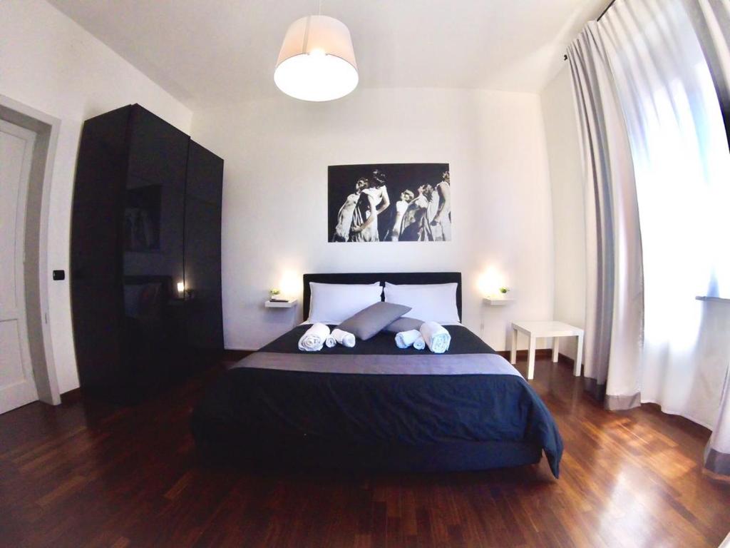 Uma cama ou camas num quarto em Mythos Affittacamere